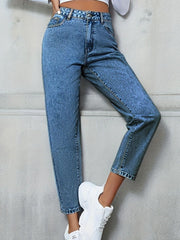 Medium wash high-rise denim jeans with a relaxed fit and button fly.