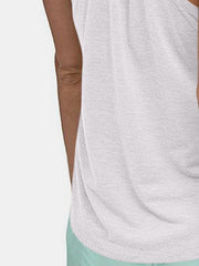White racerback performance tank top with a textured fabric detail.