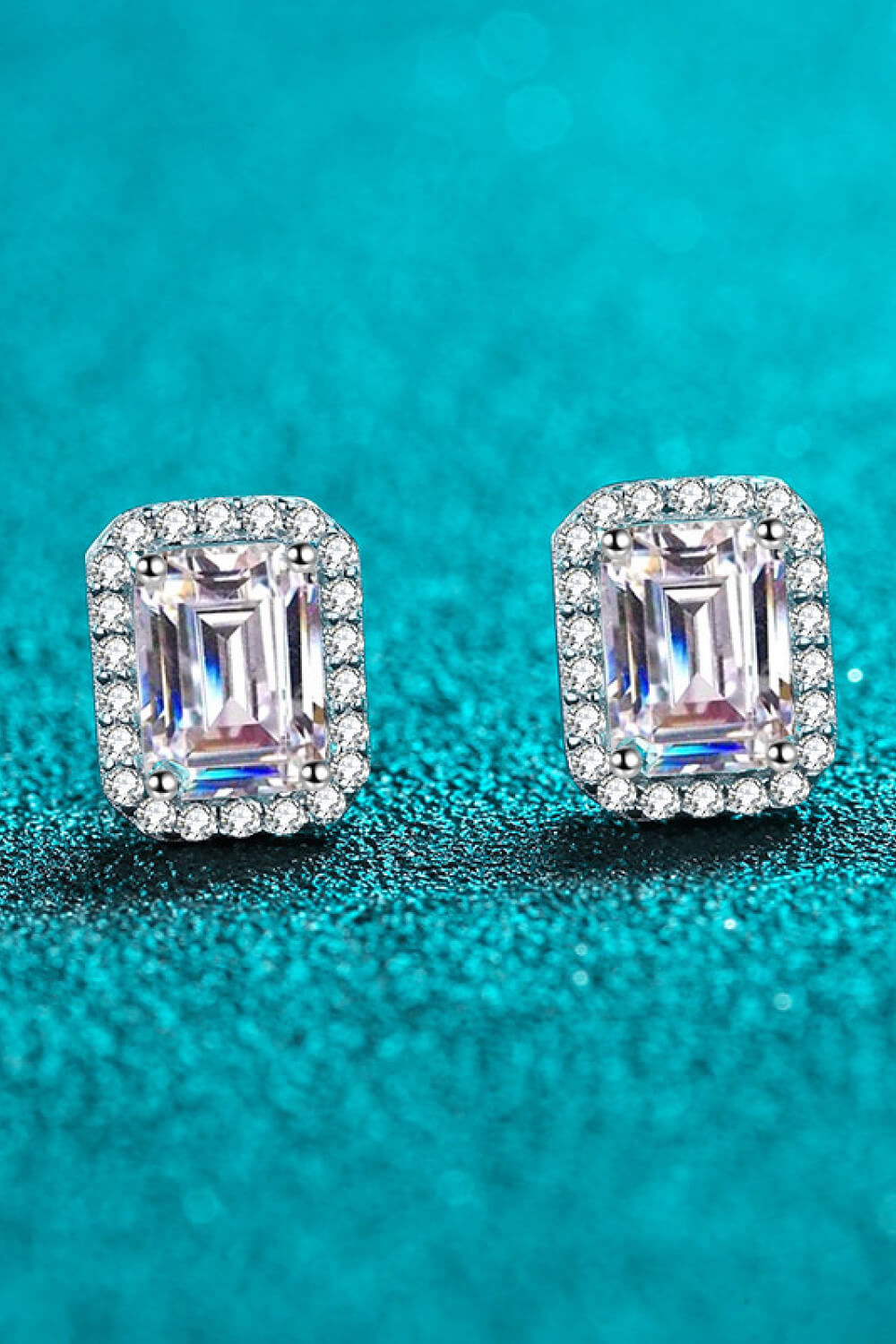 Radiant Emerald Cut Halo Studs in silver with sparkling cubic zirconia.
