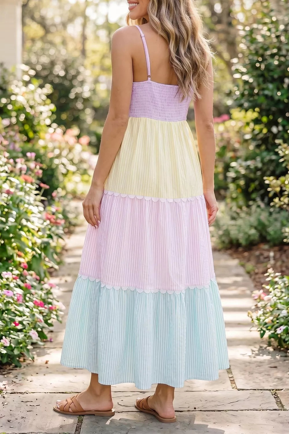 Maternity tiered dress with pastel colorblock, smocked bodice, scalloped trim, and stripe pattern.