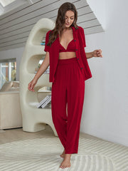 Red silk-blend 3-piece lounge set with bralette, short-sleeve shirt and wide-leg pants.