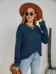 Chevron knit crewneck sweater in dark blue and green with a fuzzy texture.
