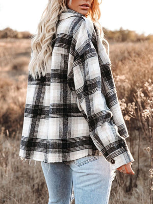 Plaid pocket long sleeve shirt jacket in black and white, with buttoned cuffs and a raw hem.