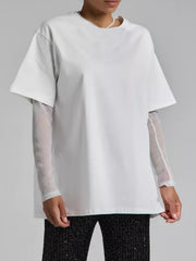 White oversized tee with sheer glitter sleeves and a crew neck.