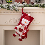 Red Christmas stocking with plush snowman, festive scarf, and snowflake details.