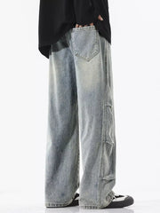 Light wash oversized wide leg jeans with distressed details and vintage fade.