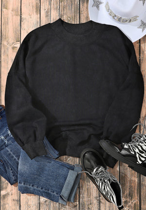 Black acid wash mock neck sweatshirt with ribbed cuffs and neckline.