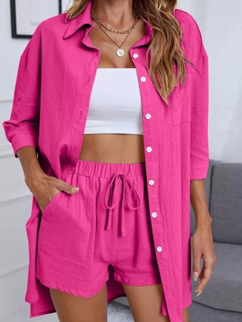 Chic collared two-piece set in hot pink with button-down shirt and drawstring shorts.