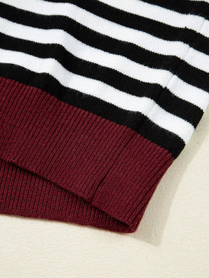 Colorblock striped knit sweater with maroon ribbed hem and cuffs.