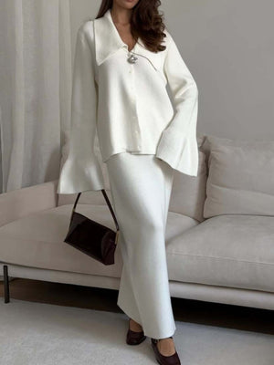 Milky white ribbed knit cardigan with collar and flared sleeves, paired with a matching knit skirt.
