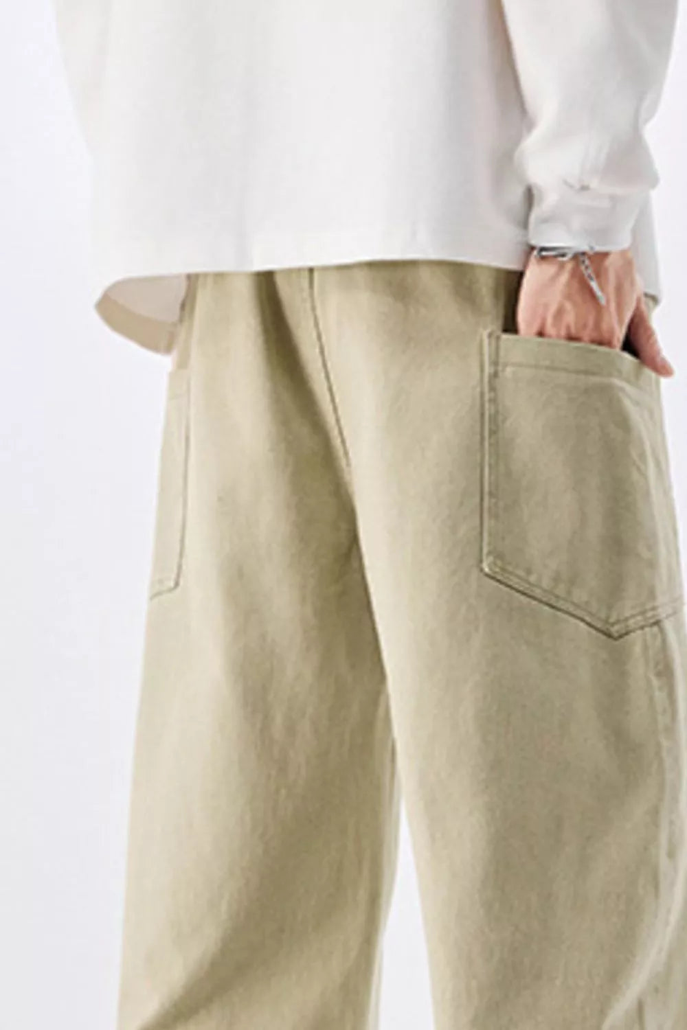 Men's relaxed fit cotton jeans in sage with drawstring waist and patch pockets.