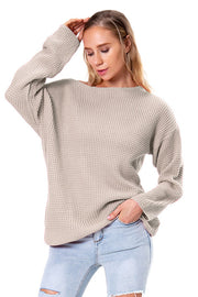 Off-shoulder waffle knit sweater in beige with slouchy fit and boat neck.