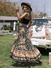 Bohemian floral asymmetric midi skirt with ruffled hem and multicolor print.