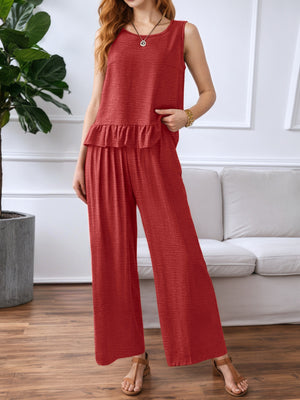 Red ruffled hem sleeveless top and wide-leg pants set with textured fabric.