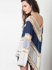 Blue and white long sleeve cardigan with crochet trim and cutout details.