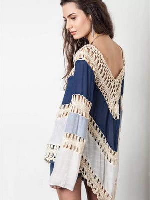Blue and white long sleeve cardigan with crochet trim and cutout details.