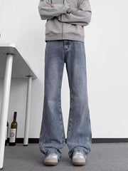 Blue wide-leg jeans with star embroidery detail on the hem.