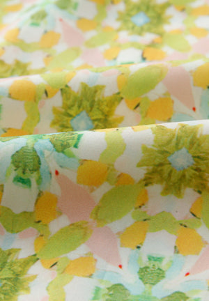 Floral ruffle yoke button-down blouse in yellow green with a painterly floral print.