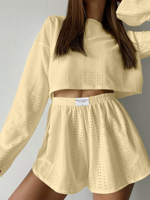 Light Yellow perforated crop top and shorts set with a textured knit fabric.