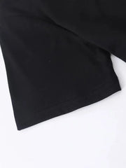Black t-shirt detail showing hem stitching