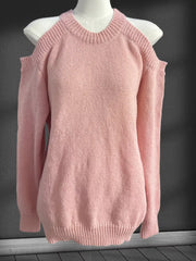 Pink knit cold shoulder sweater with crew neck and long sleeves.