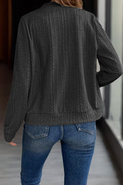 Textured ribbed bomber jacket in gray with long sleeves and a casual fit.