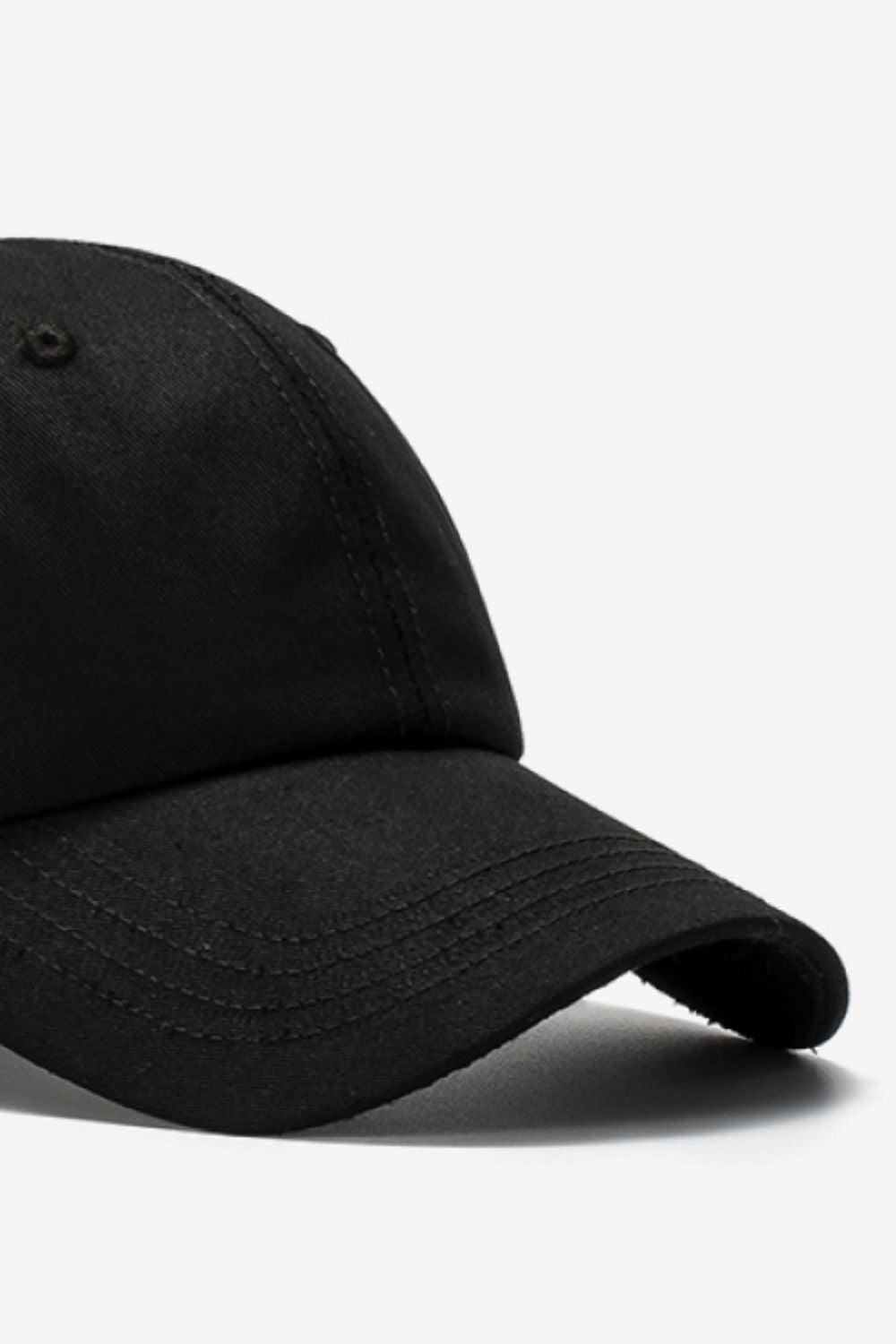 Black cotton baseball cap with stitched details on the brim.