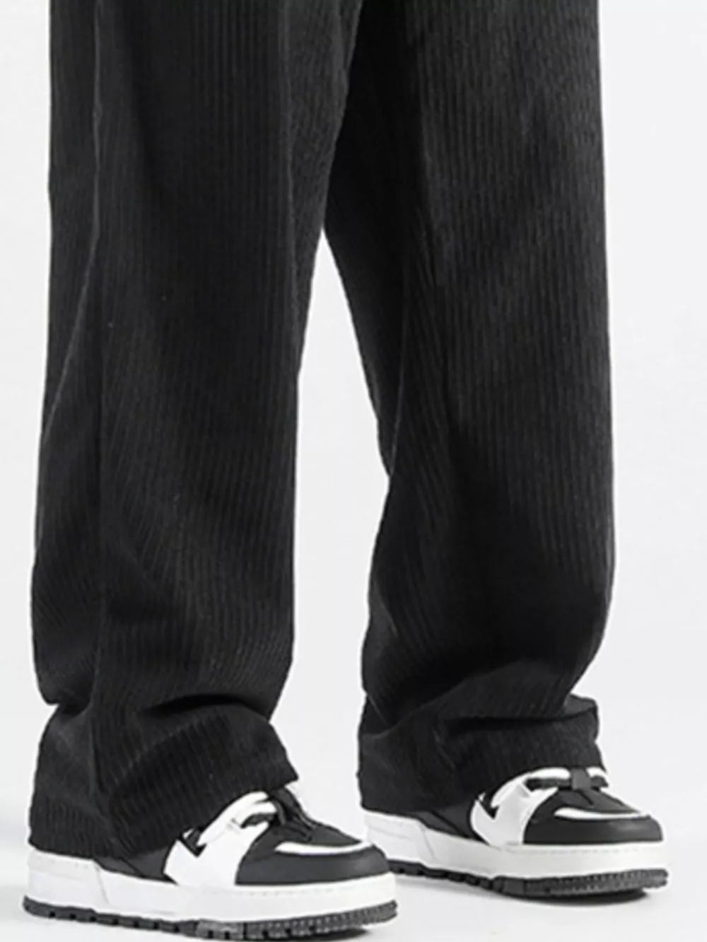 Black corduroy wide-leg sweatpants with a vertical stripe texture.