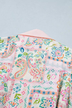 Floral patchwork mini dress with pink collar and 3/4 sleeves.
