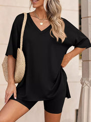 Black V-neck two-piece set with short sleeves and side slits, paired with biker shorts.