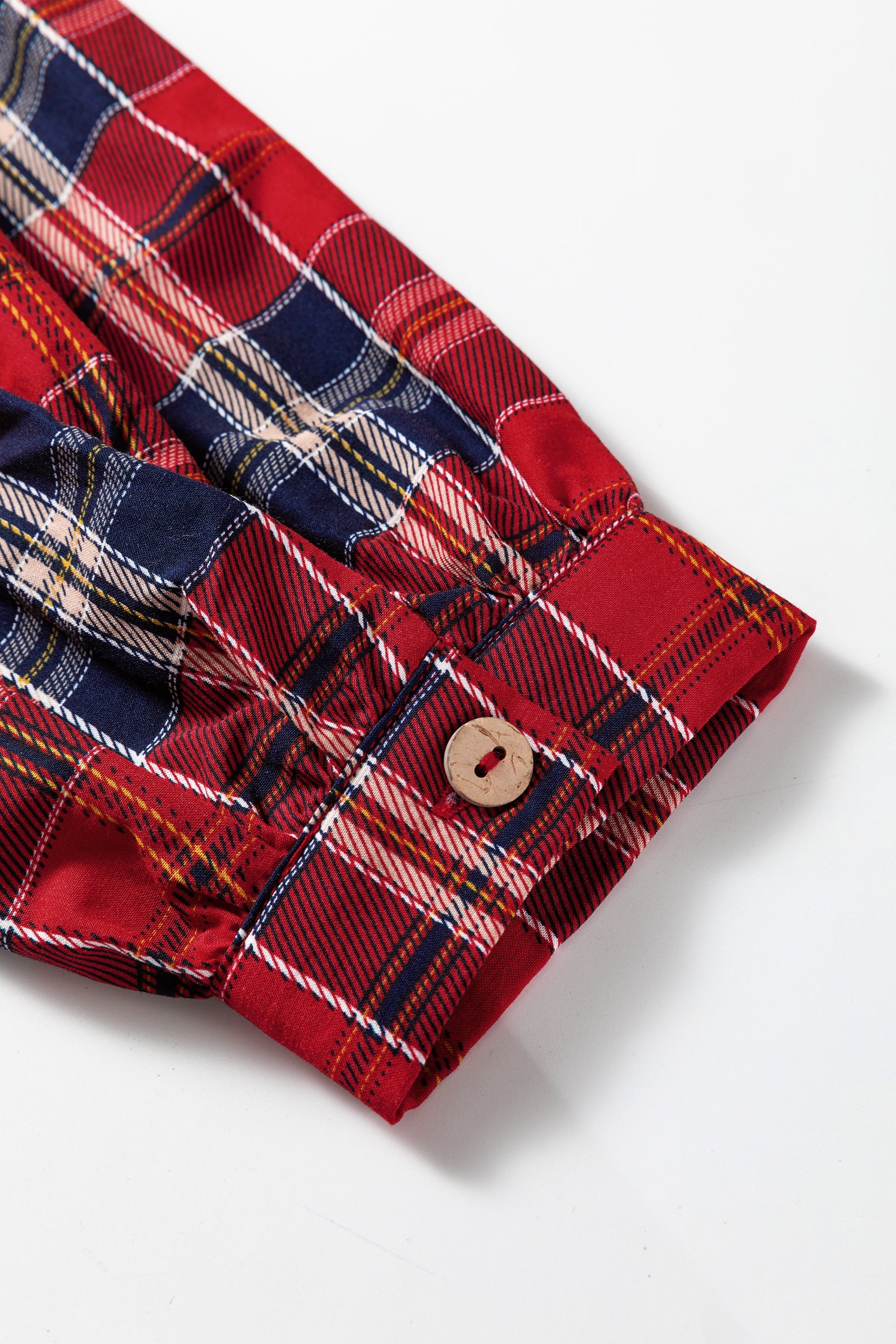Charming tartan mini dress with frilly collar, red plaid cotton blend button-down sleeve detail.
