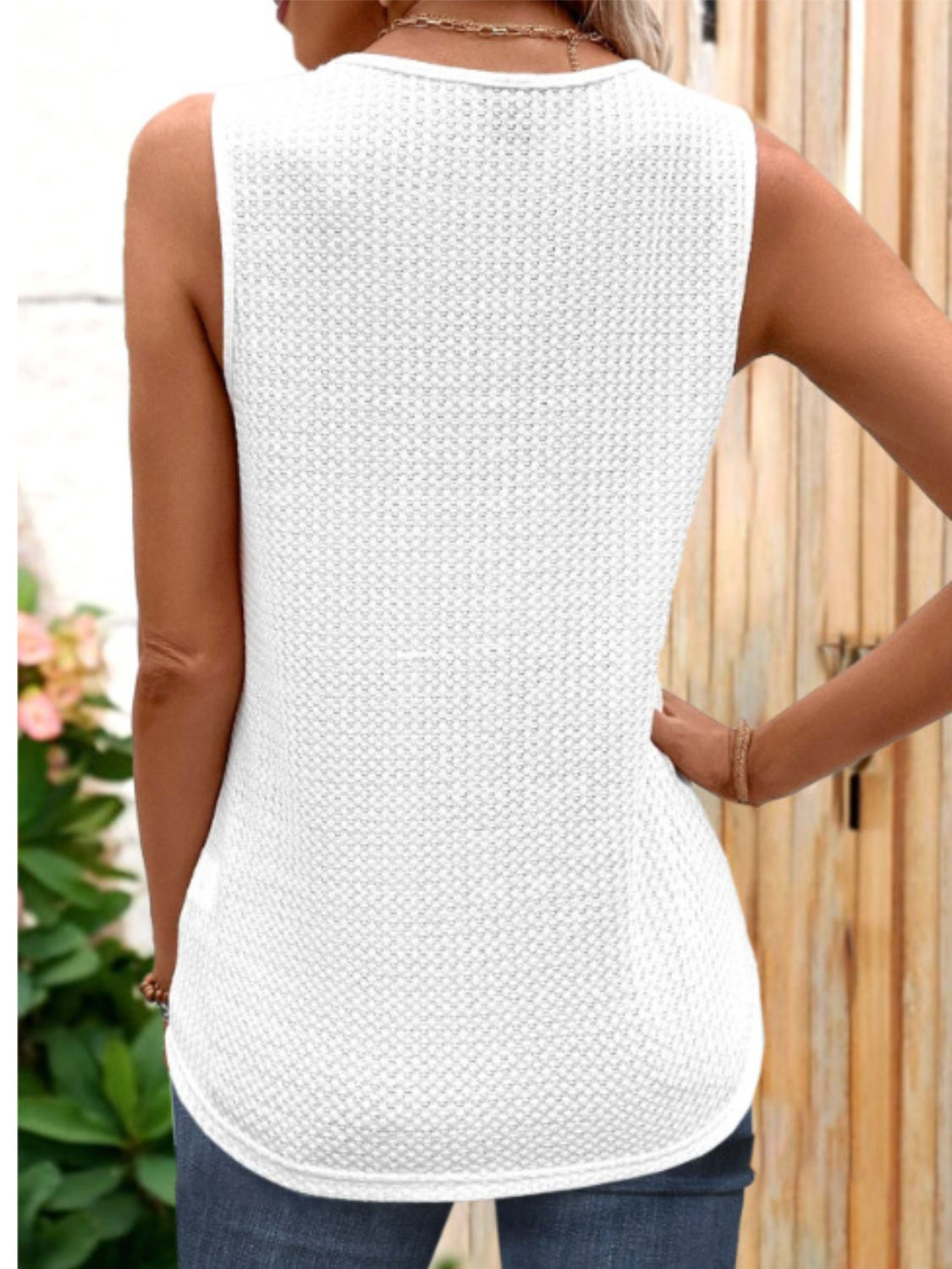 White textured knit sleeveless blouse with metallic trim detail