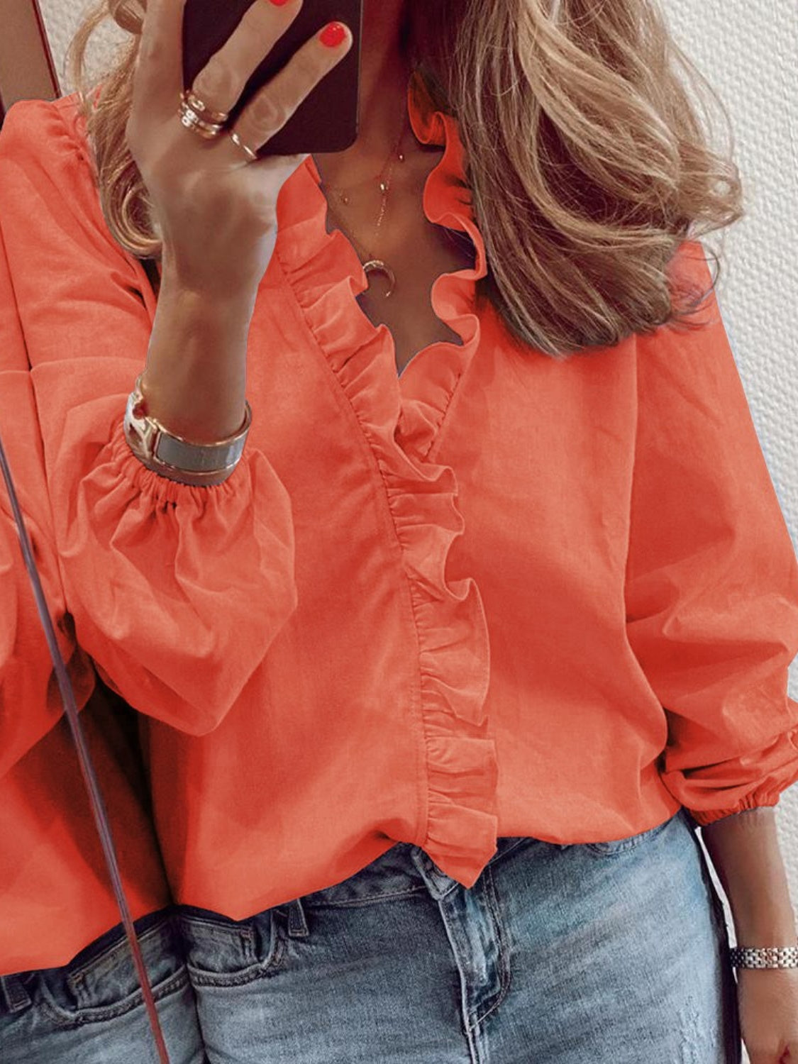 Pumpkin blouse with cascading ruffles and balloon sleeves.