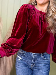 Burgundy velvet blouse with ruched neckline and long puff sleeves