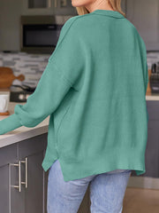 Teal ribbed-knit relaxed fit sweater with collar detail and side slits.