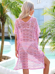 Pink lace-knit kaftan cover up with side tie detail and open knit pattern.