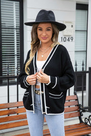 Black acrylic cardigan with white trim and pockets, button front, v-neck
