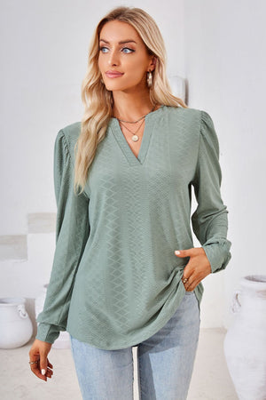 Sage textured bishop sleeve blouse with v-neck and puff shoulders