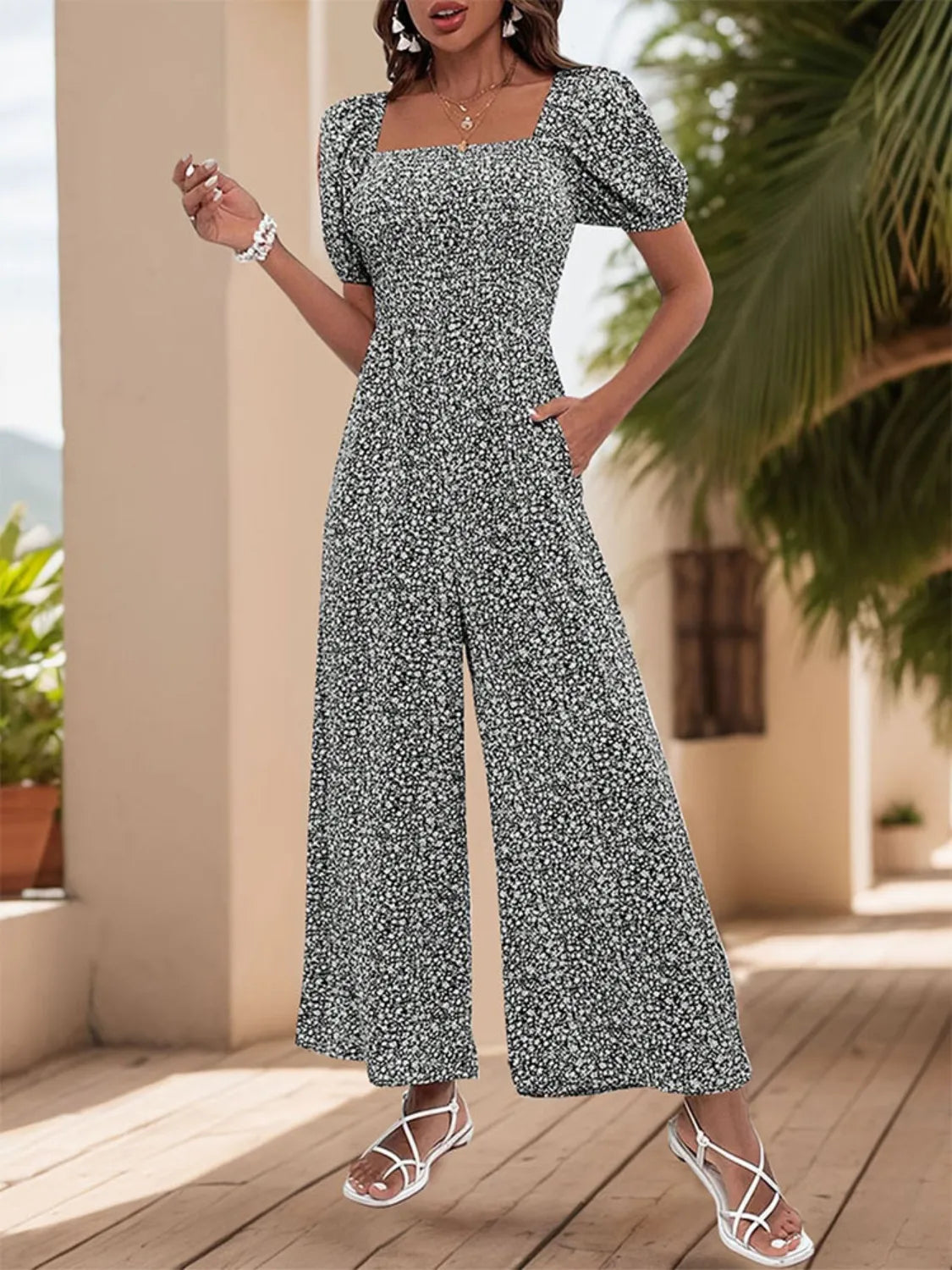 Smocked bodice floral wide-leg jumpsuit with square neckline and puff sleeves in Black White.
