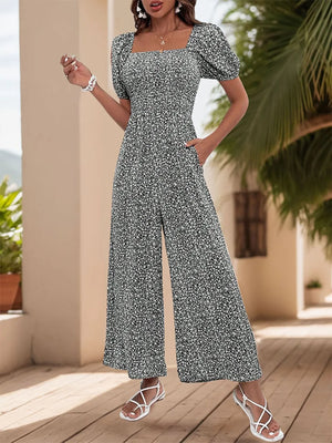 Smocked bodice floral wide-leg jumpsuit with square neckline and puff sleeves in Black White.