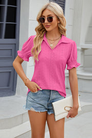 Hot pink eyelet polo blouse with short ruffled sleeves and a v-neck.