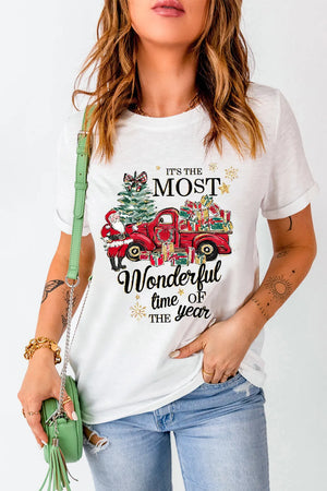 White graphic tee with festive Christmas truck, Santa, tree, and gifts design.