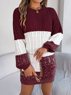 Colorblock cable knit mini dress in burgundy and white acrylic with crew neck.