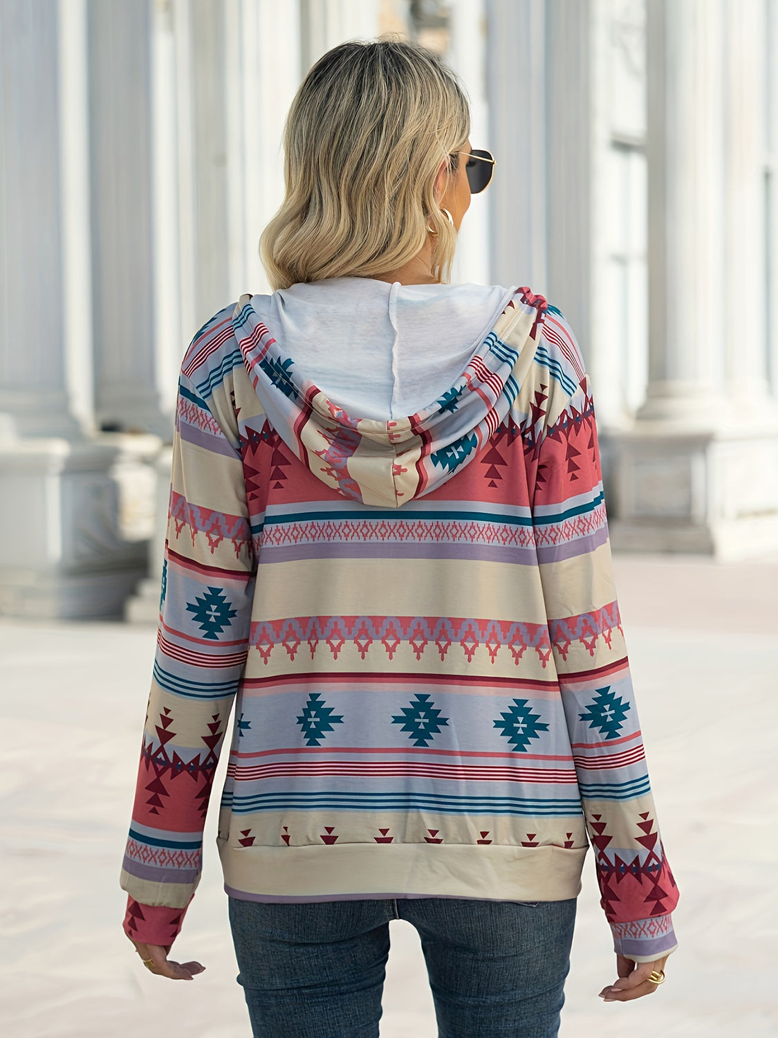 Aztec print hooded jacket with long sleeves and a relaxed fit.
