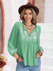 Embroidered yoke blouse in Gum Leaf green with gathered bodice and tie-neck.
