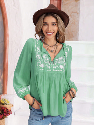 Embroidered yoke blouse in Gum Leaf green with gathered bodice and tie-neck.
