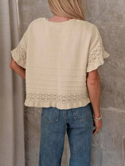 Khaki knit top with crew neck, short sleeves, and delicate lace trim at hem and sleeves.