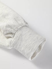 Light gray tunic sweatshirt sleeve with gathered detail and ribbed cuff.