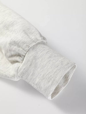 Light gray tunic sweatshirt sleeve with gathered detail and ribbed cuff.