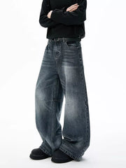 Belted dark-wash wide-leg jeans with unique paneled design and a relaxed fit.